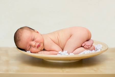 Baby boy in a plate の写真素材