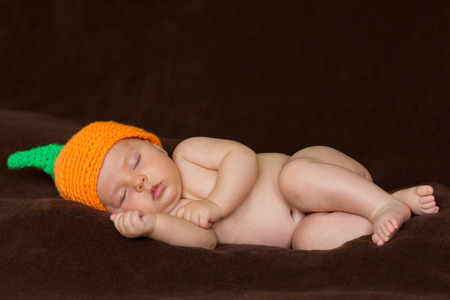 Baby boy, lying in bedの写真素材