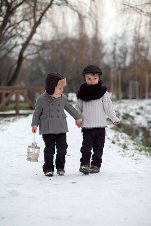 Brothers out in the snowの写真素材