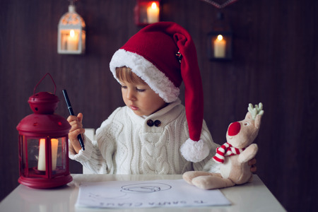 Boy, writing letter to Santaの写真素材