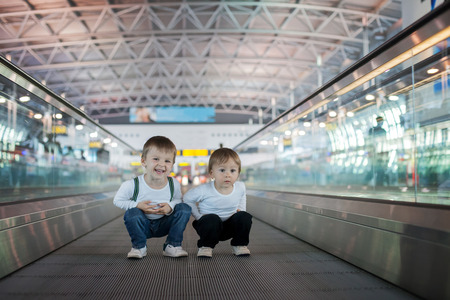 Boys at the airport quick moving lineの写真素材