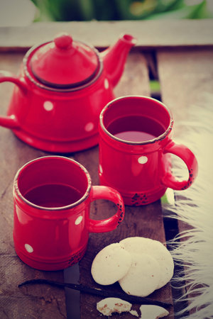 Cups with tea, teapot and cookies, vintage styleの写真素材