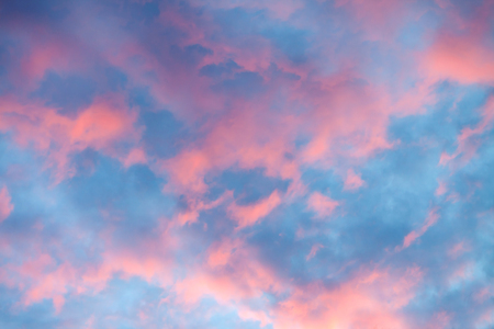 Sky clouds texture, background. Dramatic cotton candy sky cloud texture background