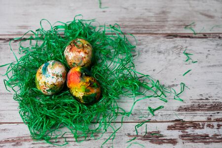 Colorful easter eggs on rustic wooden backgroundの写真素材