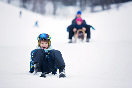 Cute child, skiing in the mountain, wintertimeの写真素材
