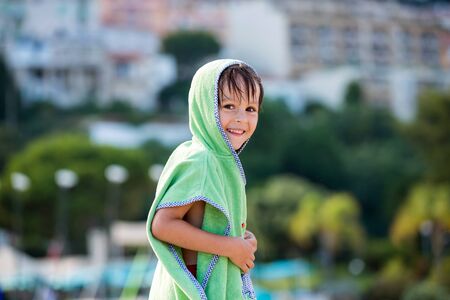 Cute portrait of a preschool child on the beach on French Rivieraの写真素材