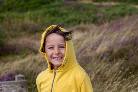 Beautiful boy, Enjoying the nature, the wind and the ocean of North Devon, Exmoor parkの写真素材