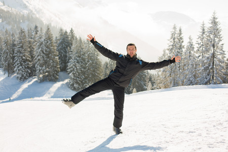 Young man, teenager, skiing on a sunny day in Austrian Aplsの写真素材