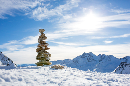 Happy people, children and adults, skiing on a sunny day in Tyrol mountains. Kids having fun while skiingの写真素材