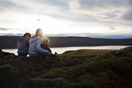 Family posing in Geothermal area in Reykjanesfolkvangur, enjoying the view of a splendid nature in Iceland, autumntimeの写真素材