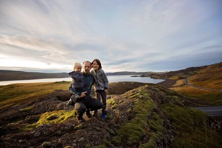 Family posing in Geothermal area in Reykjanesfolkvangur, enjoying the view of a splendid nature in Iceland, autumntimeの写真素材
