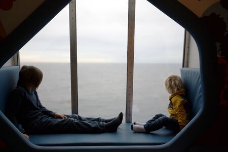 Children, playing on a ferry boat while traveling from Helsinky to Tallinn