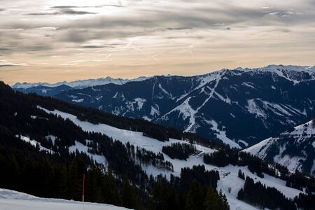 Scenery landscape in winter ski resort on a sunny day, snowy winter day on ski slopesの写真素材