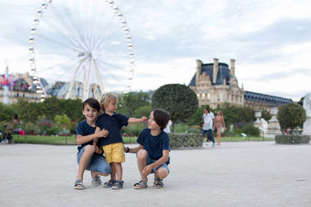 Happy children, boy brothers, visiting Paris during the summer on sunsetの写真素材