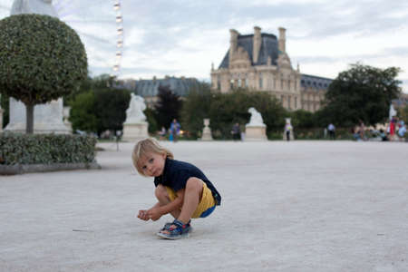 Little toddler child, blond boy, visiting Paris during summertimeの写真素材