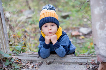Child, posing in an old ruin buildingの写真素材