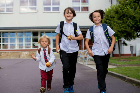 School children, boys, going back to school after the summer vacation, kids going to schoolの写真素材