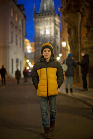 Child in Prague on Christmas, christmas lights and decoration on the squareの写真素材