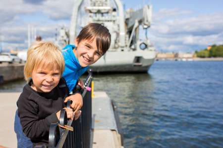 Young preschool child, visiting city of Stockholm with his family, summertime, Swedenの写真素材