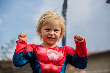 Child, jumping on a trampoline with static hair from the trampolineの写真素材