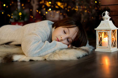 Happy family with children and pet dog, enjoying Christmas time together, celebrating christmasの写真素材