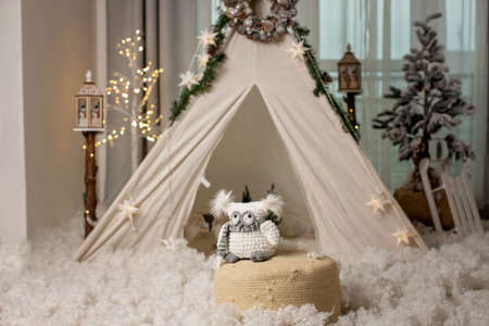 Winter scene with teepee, light tree, christmas tree and street lamps. Snowy decorの写真素材