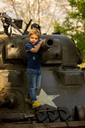 Toddler child, kid at military exhibition in Plsen, parade for the wirld war IIの写真素材