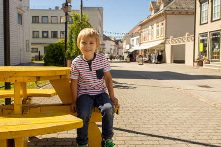 Children, family, visiting small village Flekkefjord during summer vacation in Norwayの写真素材