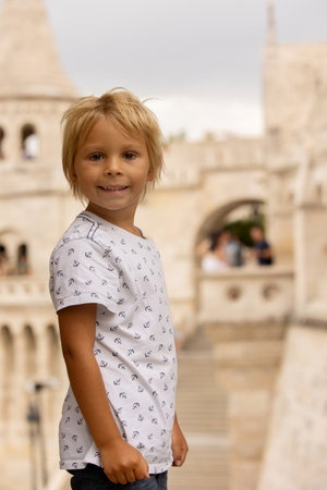 Child, boy, visiting the castle in Budapest on a summer day, Hungaryの写真素材