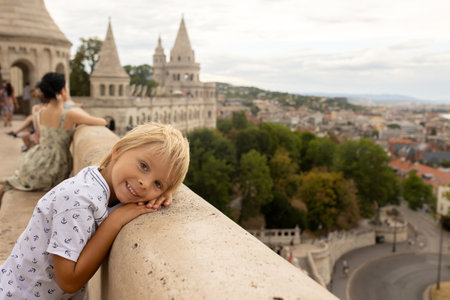 Child, boy, visiting the castle in Budapest on a summer day, Hungaryの写真素材