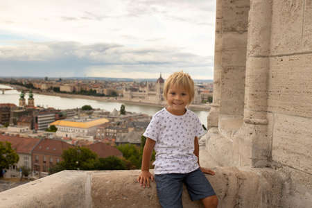 Child, boy, visiting the castle in Budapest on a summer day, Hungaryの写真素材