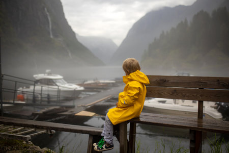 People, children enjoying the amazing views in Norway to fjords, mountains and other beautiful nature miraclesの写真素材