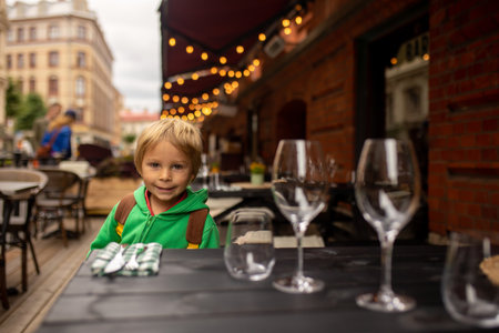 Child, visiting Gothenburg, city in Sweden summertime, eating Churrosの写真素材