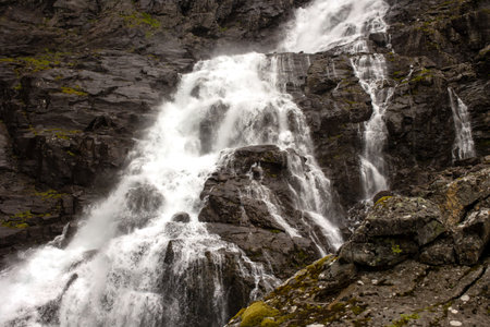 Family, children and adults, visiting the famous Trollstigen road in Norwayの写真素材