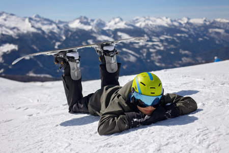 Happy family, enjoying ski holiday with children, sunny beautiful weather outdoorsの写真素材