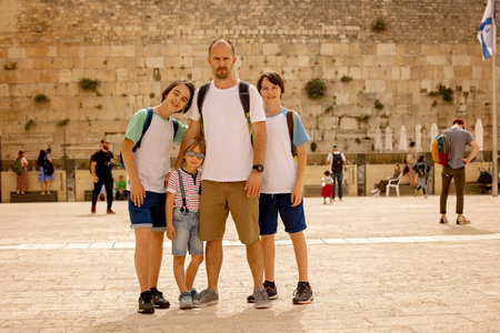 European tourist family with children, visiting Jerusalem, meeting new cultureの写真素材