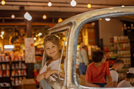 Family with kids, enjoying the Sarona Market in Tel Aviv, Israel, trying the foodの写真素材