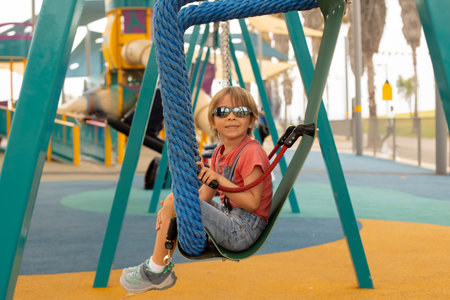 Happy children, boys, playing on playground in Tel Aviv, israel on a hot summer dayの写真素材