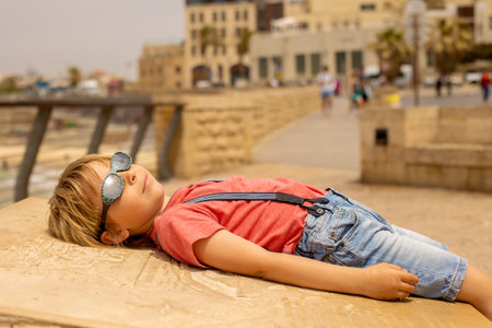 European tourist family with children, visiting Tel Aviv, Israel, enjoying day walk in the cityの写真素材