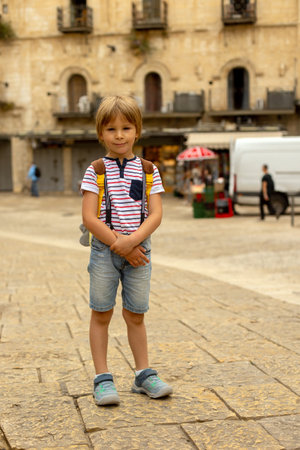 European tourist family with children, visiting Jerusalem, meeting new cultureの写真素材