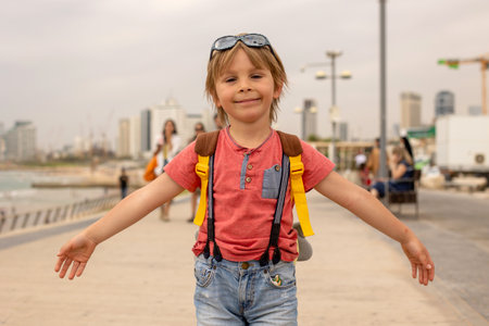 European tourist family with children, visiting Tel Aviv, Israel, enjoying day walk in the cityの写真素材