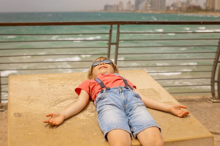 European tourist family with children, visiting Tel Aviv, Israel, enjoying day walk in the city