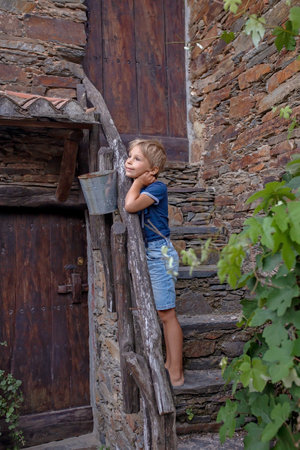 Beautiful medieval village Talasnal in Lousa, Portugal on a beautiful day. Child playing on the...