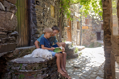 Beautiful medieval village Talasnal in Lousa, Portugal on a beautiful day. Child playing on the...