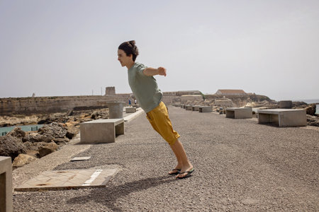 Famil with children, visiting the most south point of Europe, Tarifa in Spain