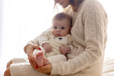 Happy family, newborn baby and older brothers, mom at home on Christmasの写真素材