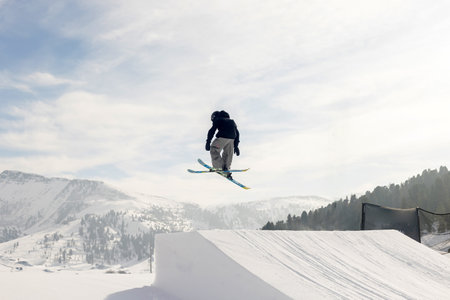 Children and adults, happy family in winter clothing at ski vacation, skiing, wintertimeの写真素材