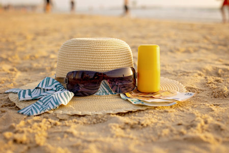 Vacation time - straw hat, sunglasses, suncream and money, ready for a holiday Tel Aviv, Israelの写真素材