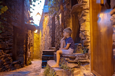 Beautiful medieval village Talasnal in Lousa, Portugal on a beautiful day. Child playing on the...