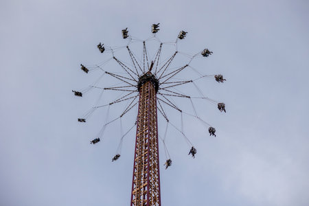 Happy children, enjoying a day in amusement park  with familyの写真素材